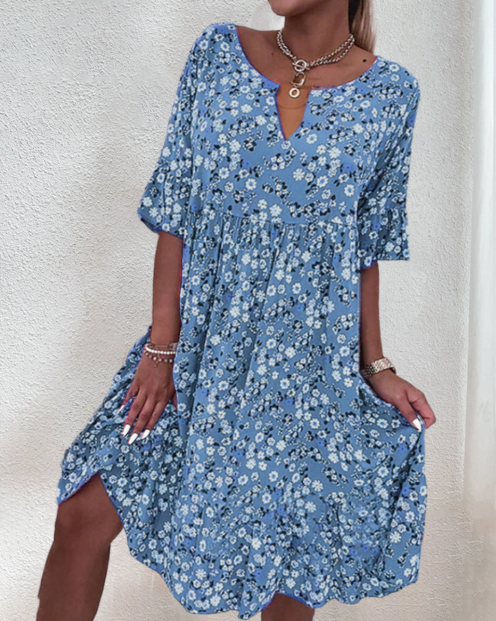 Women's floral print midi dress with V-neck, short sleeves, and smocked elastic waist