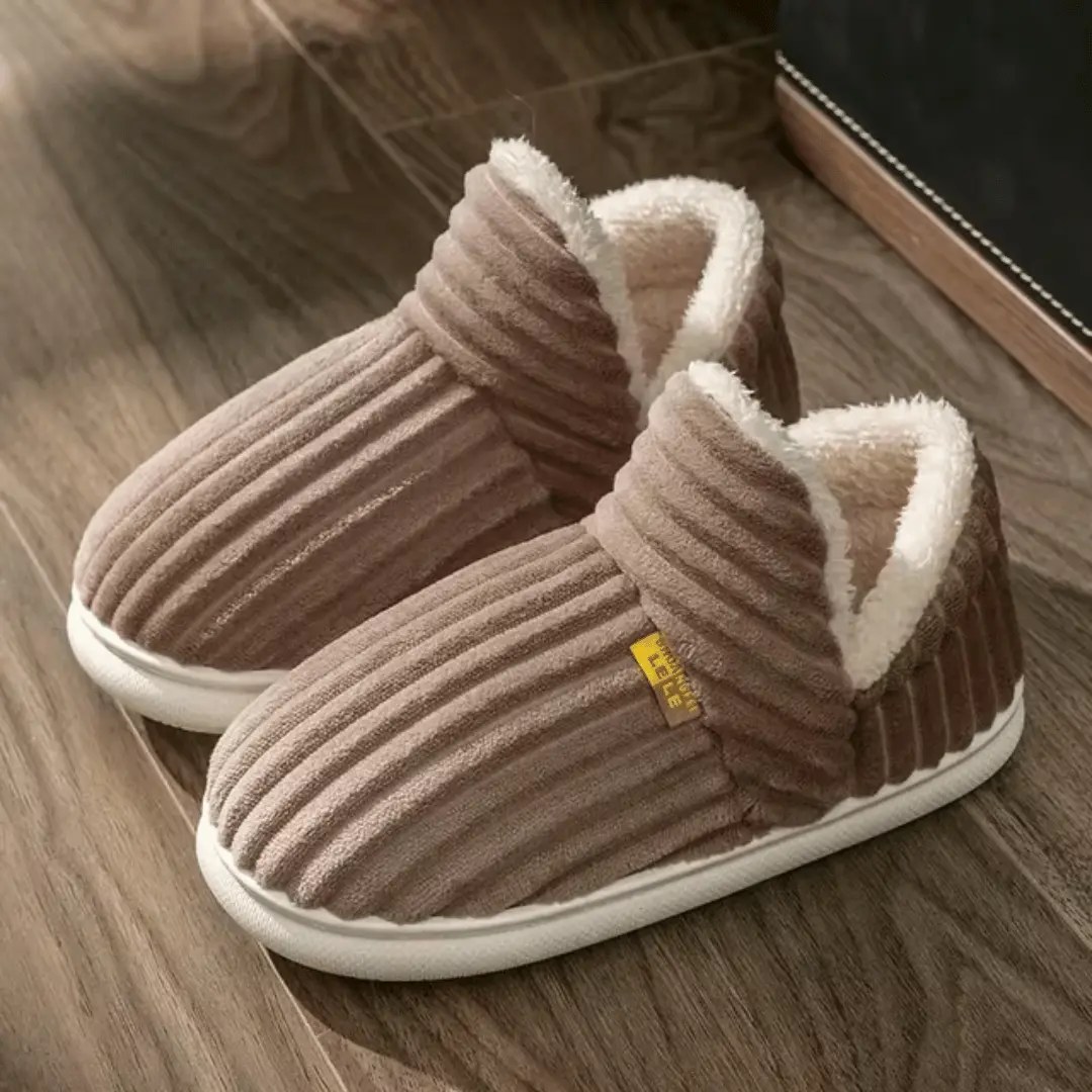 Cozy slip-on sherpa fleece slippers with plush lining and non-slip rubber sole for indoor comfort