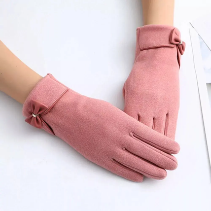 Black winter gloves with bow detail, split-finger touchscreen-compatible design for elegant cold weather style
