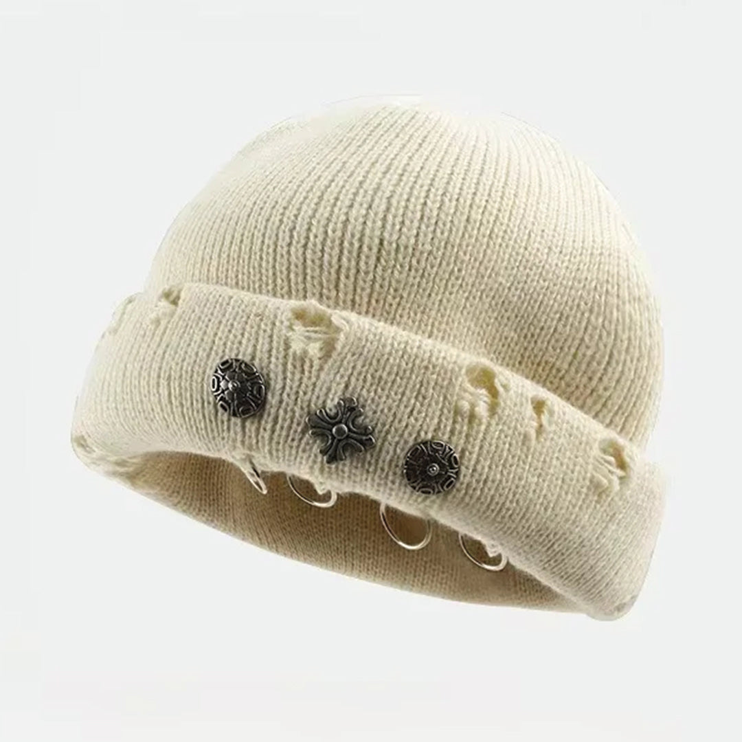 Black knit beanie with cross piercing hardware accents and distressed cuff streetwear style