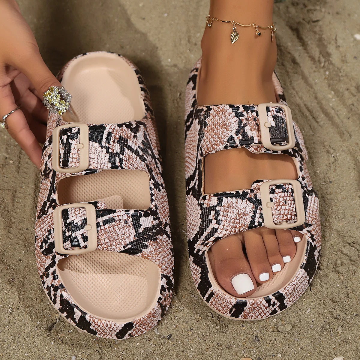 Women's flat adjustable buckle sandals in neutral tone, minimalist slide style with double-buckle strap