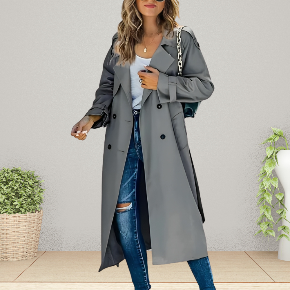 Women's beige double-breasted longline trench coat with classic tailoring and symmetrical button front