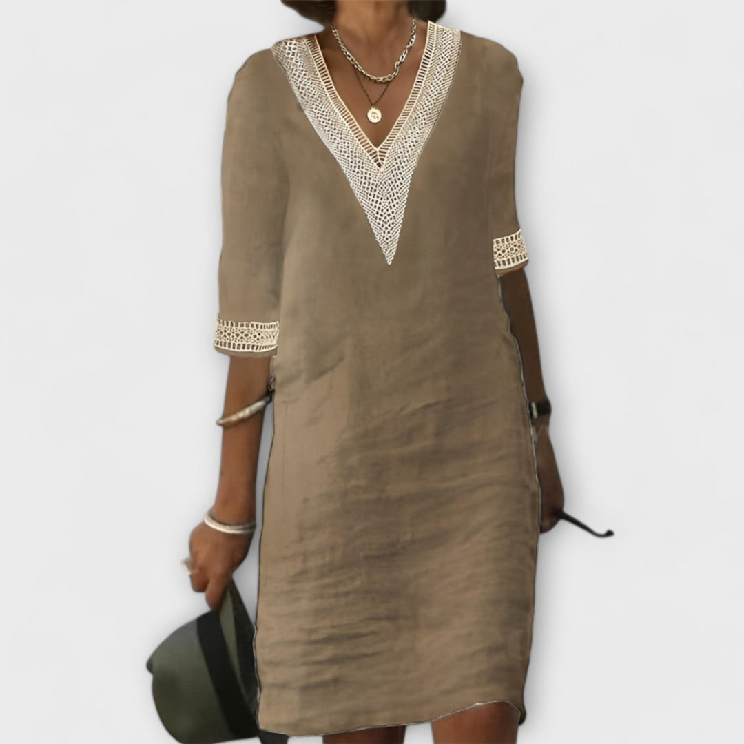 Ivory boho crochet dress with flowing silhouette, intricate lace-like details and relaxed airy fit