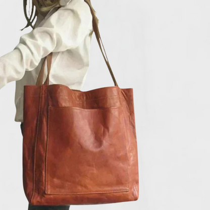 Minimalist black robust tote bag with spacious silhouette and clean structured design
