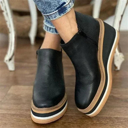 Women's black platform wedge ankle boots with cushioned footbed and elevated stable sole