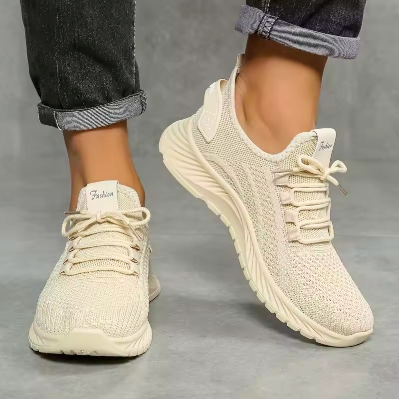 White comfort lace-up sneakers with breathable mesh upper and cushioned sole support