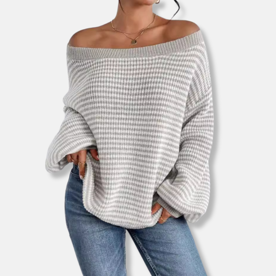 Women's loose knit sweater with boat neckline and statement lantern sleeves for relaxed elegance