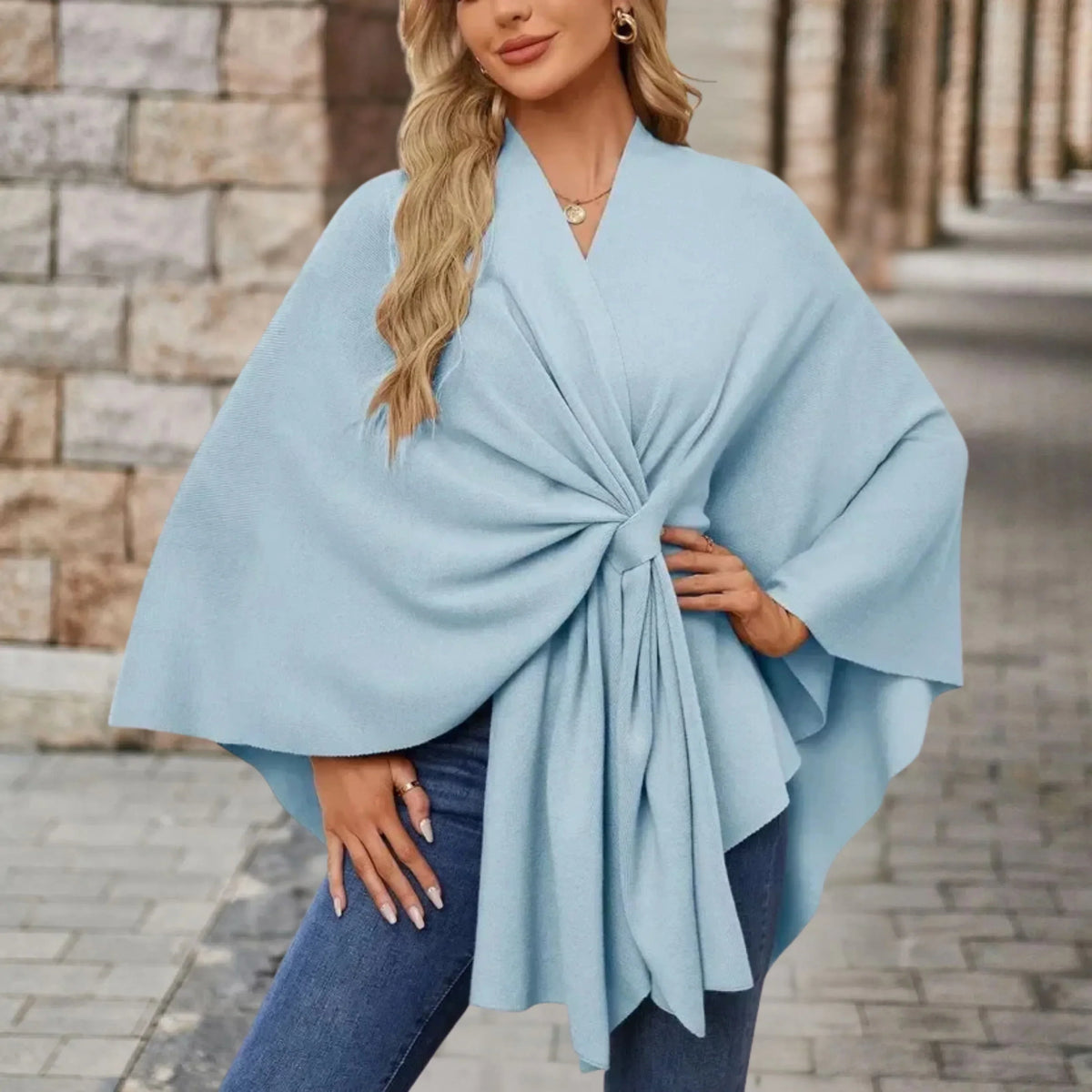 Elegant draped poncho with chic front knot, flowing silhouette, soft cozy fabric, versatile statement layer