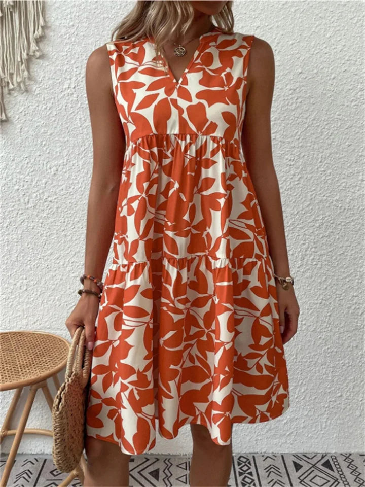 Flowy floral midi dress with elegant drape, waist-defining fit, and feminine blooming print for summer