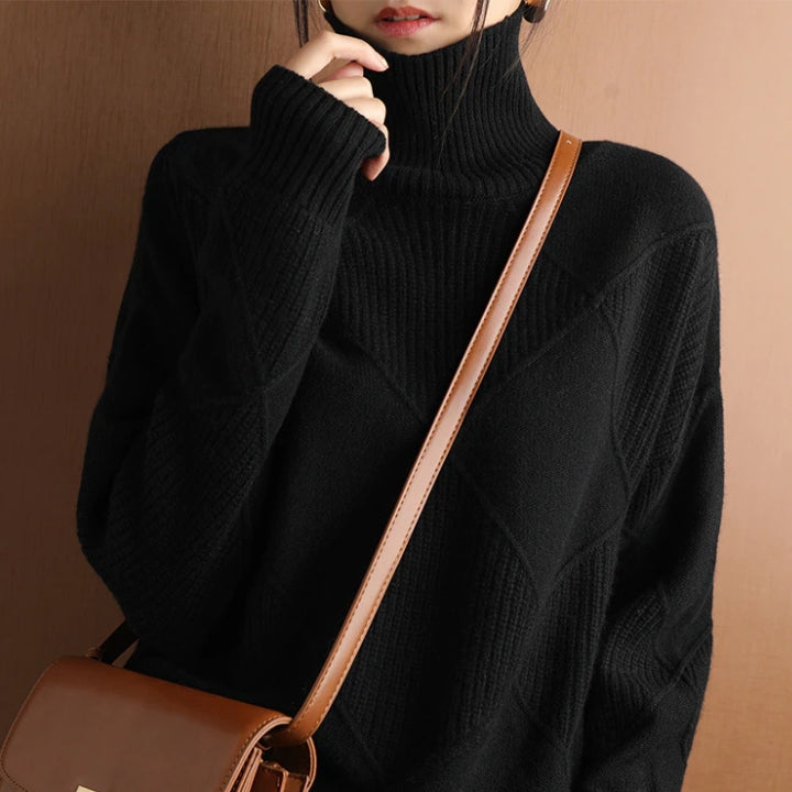 Women's oversized ribbed knit sweater in cozy neutral tones with relaxed silhouette and chunky texture