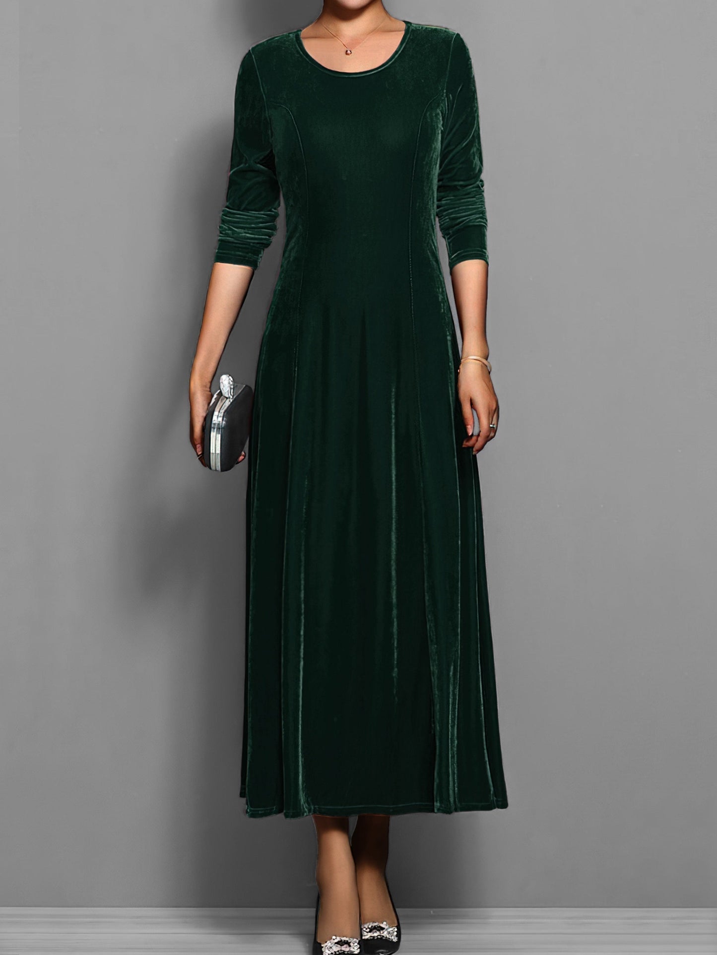 Soft velvet midi dress in rich jewel tone with elegant drape and luxurious texture