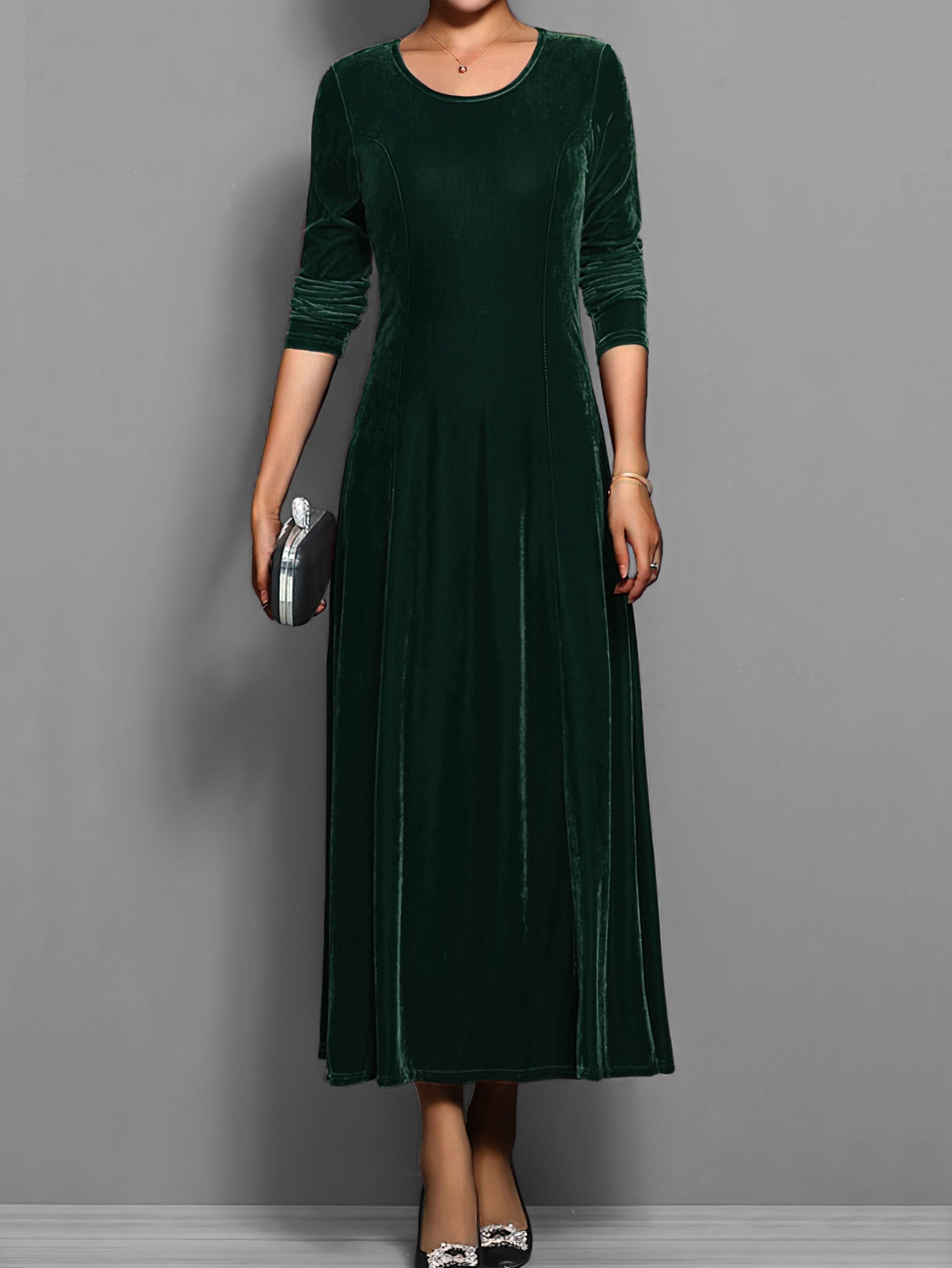 Soft velvet midi dress in rich jewel tone with elegant drape and luxurious texture