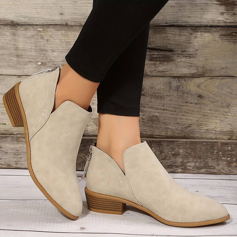 Women's casual slip-on ankle boots with low block heel and side openings for easy on-off wear
