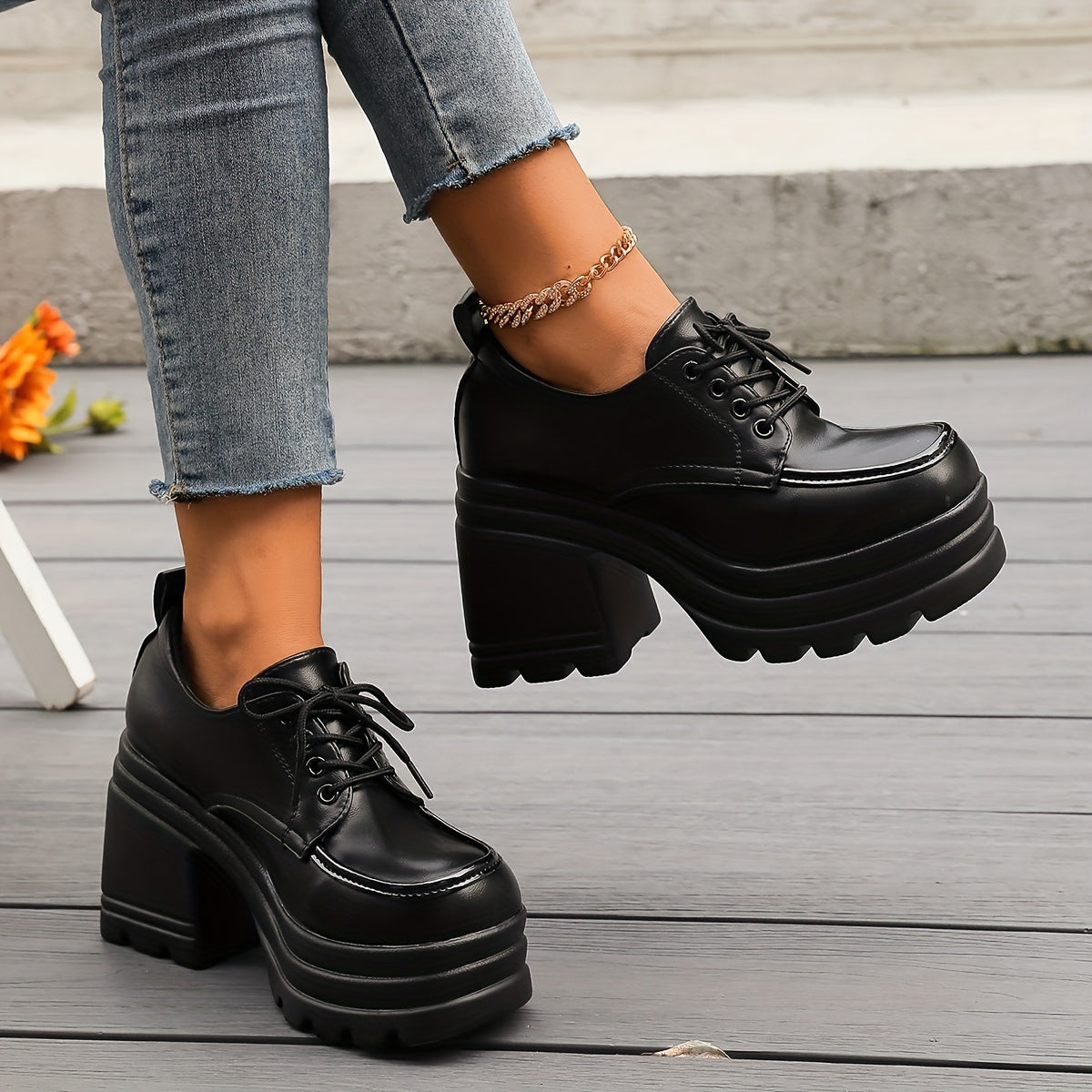 Women's black faux leather lace-up platform oxfords with chunky block heel and bold sole