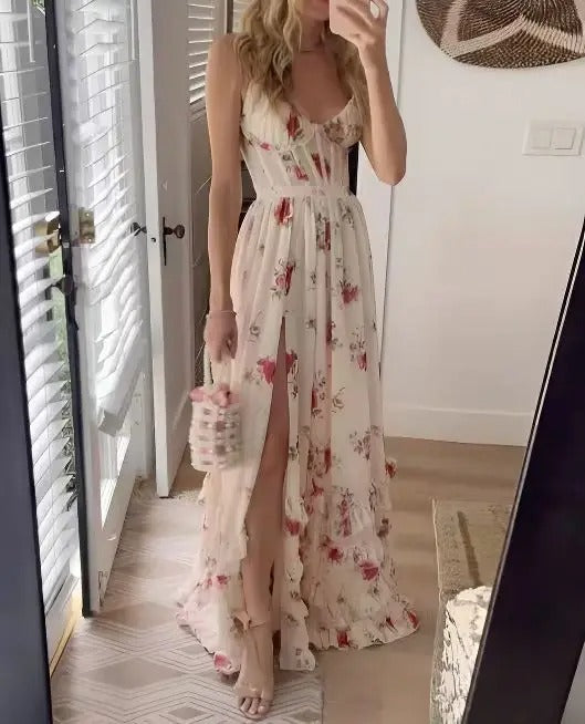 Women's floral midi dress in soft pastel tones, elegant wrap-style silhouette perfect for wedding guests