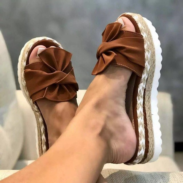 Women's woven wedge sandals with bow detail, feminine style and day-long comfort lift