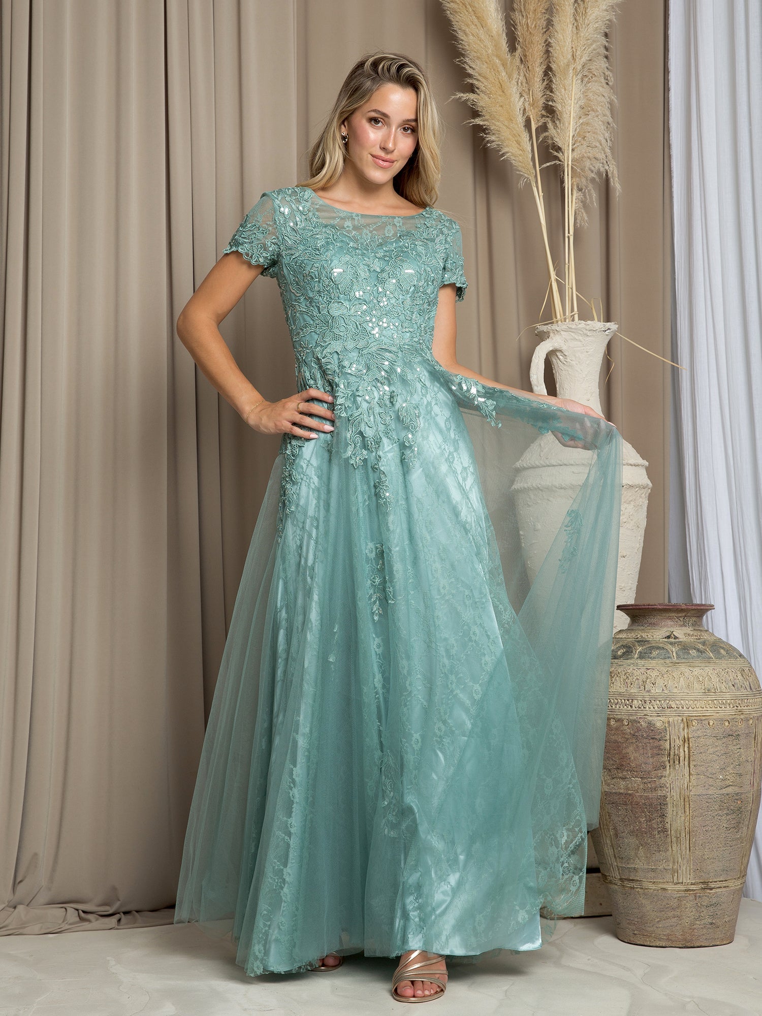 Long formal A-line mother of the bride dress in elegant floor-length silhouette with structured waist