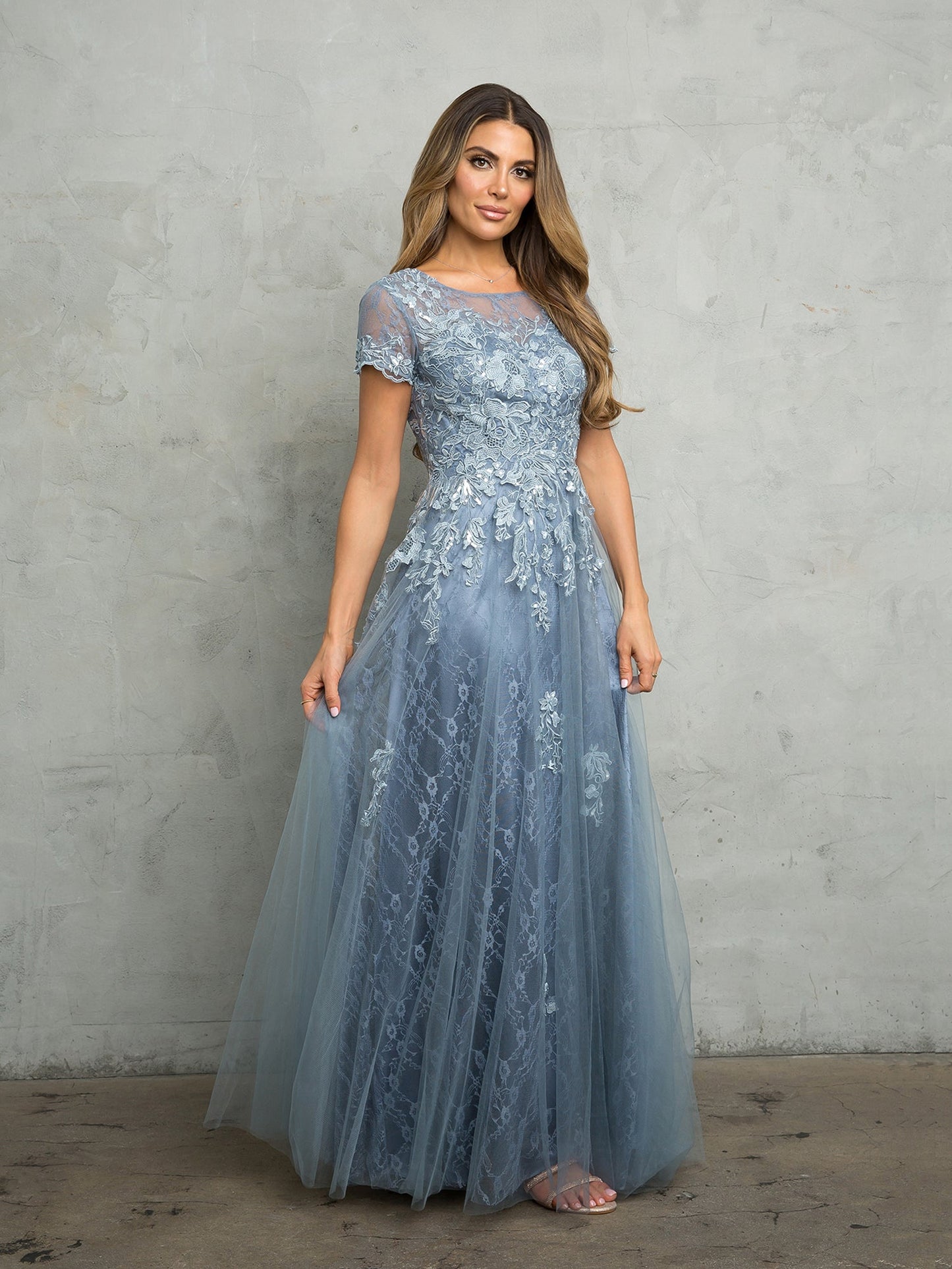 Long formal A-line mother of the bride dress in elegant floor-length silhouette with structured waist