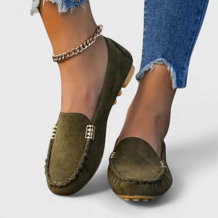 Women's fuchsia suede slip-on loafer flats with moccasin-inspired silhouette