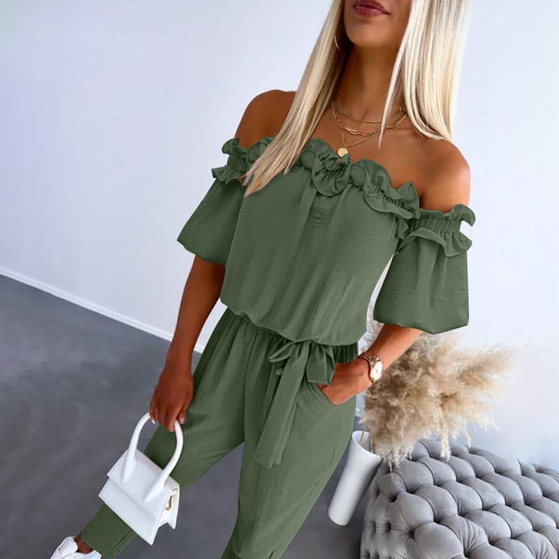 Black off-shoulder frill jumpsuit with cinched tie-waist, chic feminine silhouette