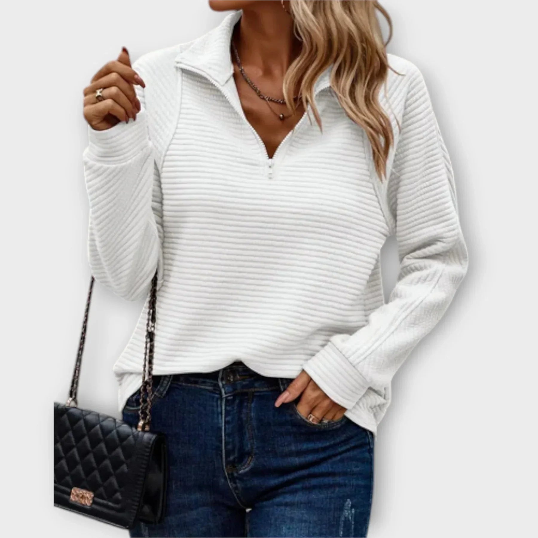 Women's half-zip pullover in neutral tone, relaxed fit with adjustable zip neckline detail