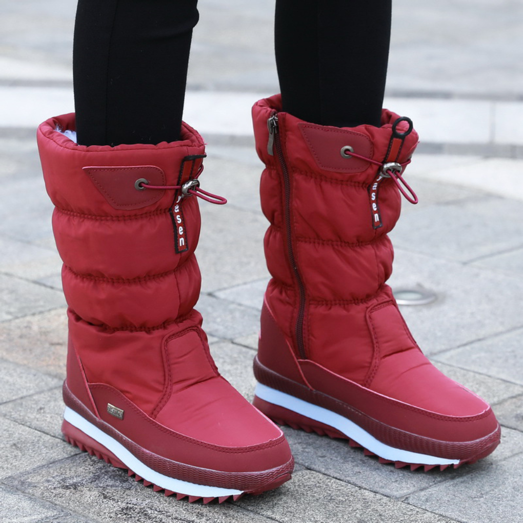 Women's black insulated winter boots with sleek zipper closure for cold-weather style and warmth