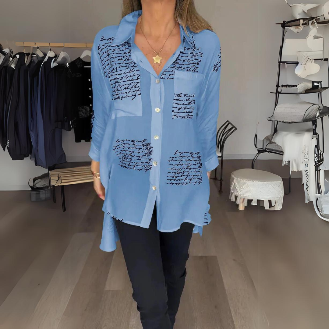 White relaxed button-up shirt with artistic handwritten script print, classic tailoring with playful twist