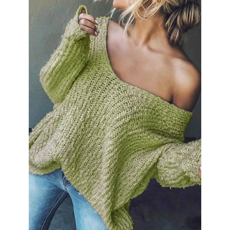 Marvia cream textured knit sweater with drop shoulders, relaxed V-neckline, and soft draped fit