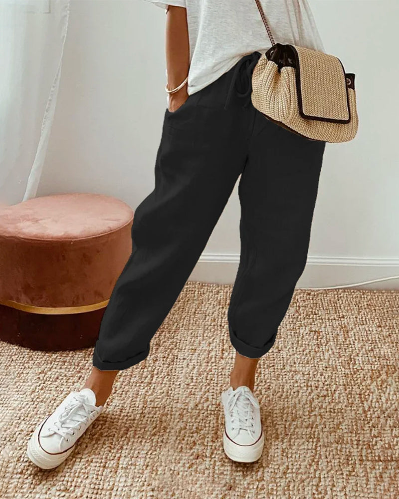 Casual elegant high-waist trousers with soft waistband and flowing breathable cut for effortless style