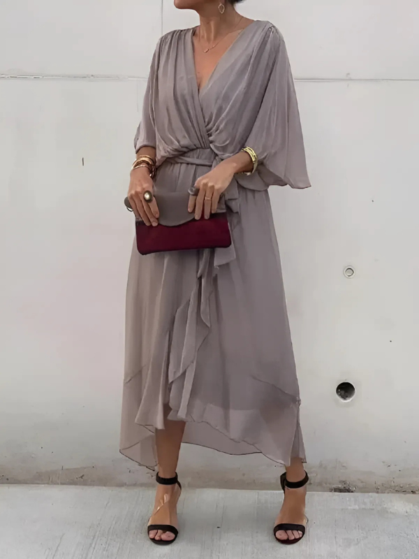 Timeless wrap midi dress in elegant silhouette with flattering V-neckline wrap closure