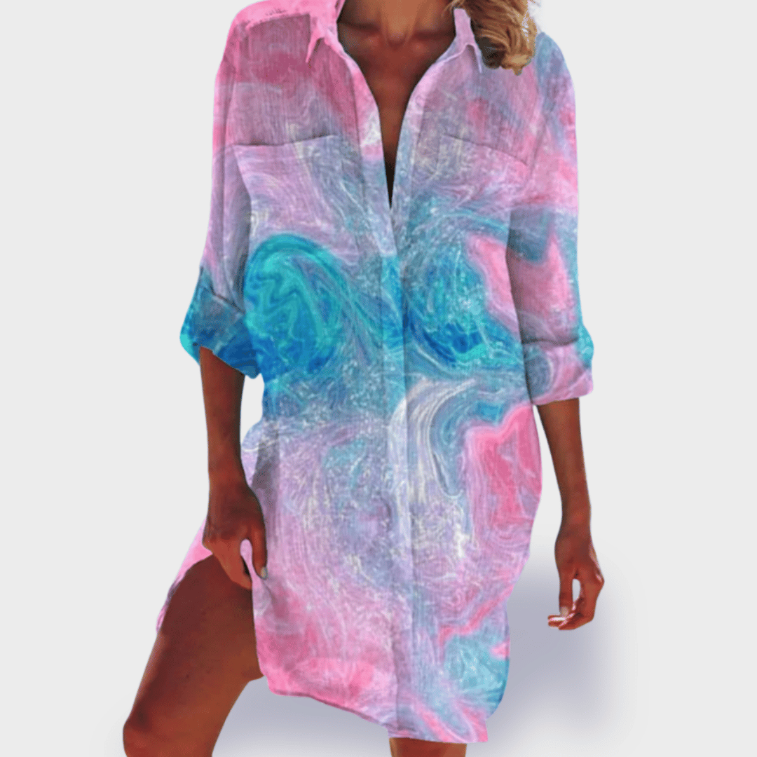 Women's flowy draped casual summer dress in colorful print with curve-flattering silhouette
