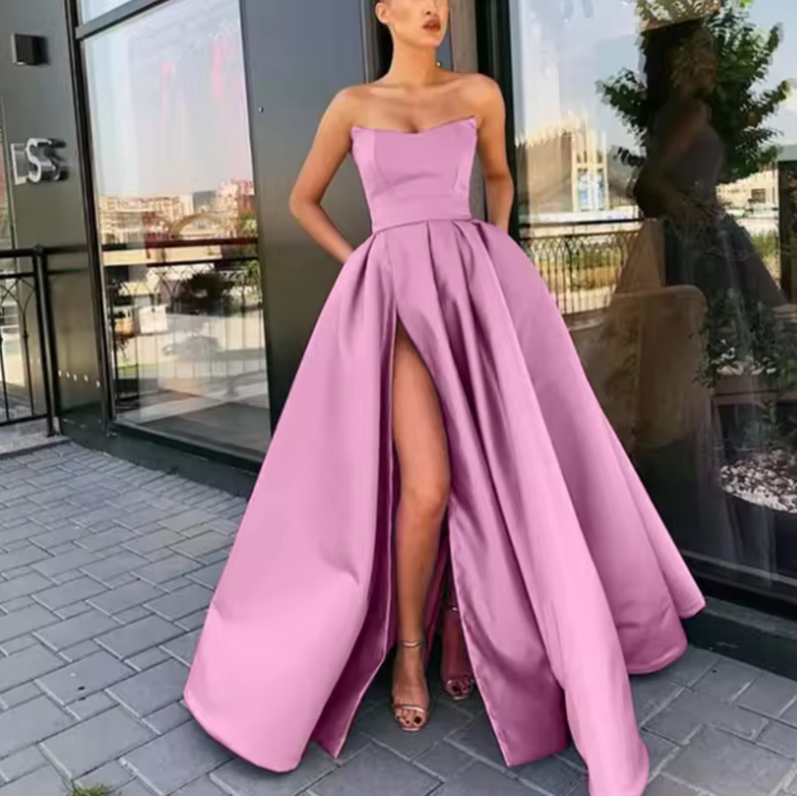 Women's black strapless A-line evening gown, floor-length formal dress with high front slit
