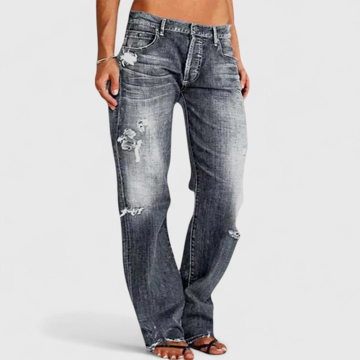 Women's low rise straight leg distressed jeans with authentic rip-and-fade denim detailing