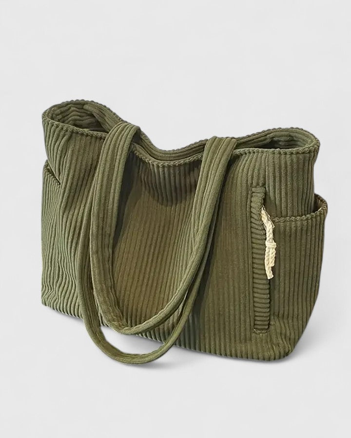 Luxurious ribbed texture handbag in sleek modern design with spacious structured silhouette