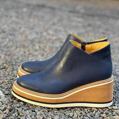 Women's black platform wedge ankle boots with cushioned footbed and elevated stable sole
