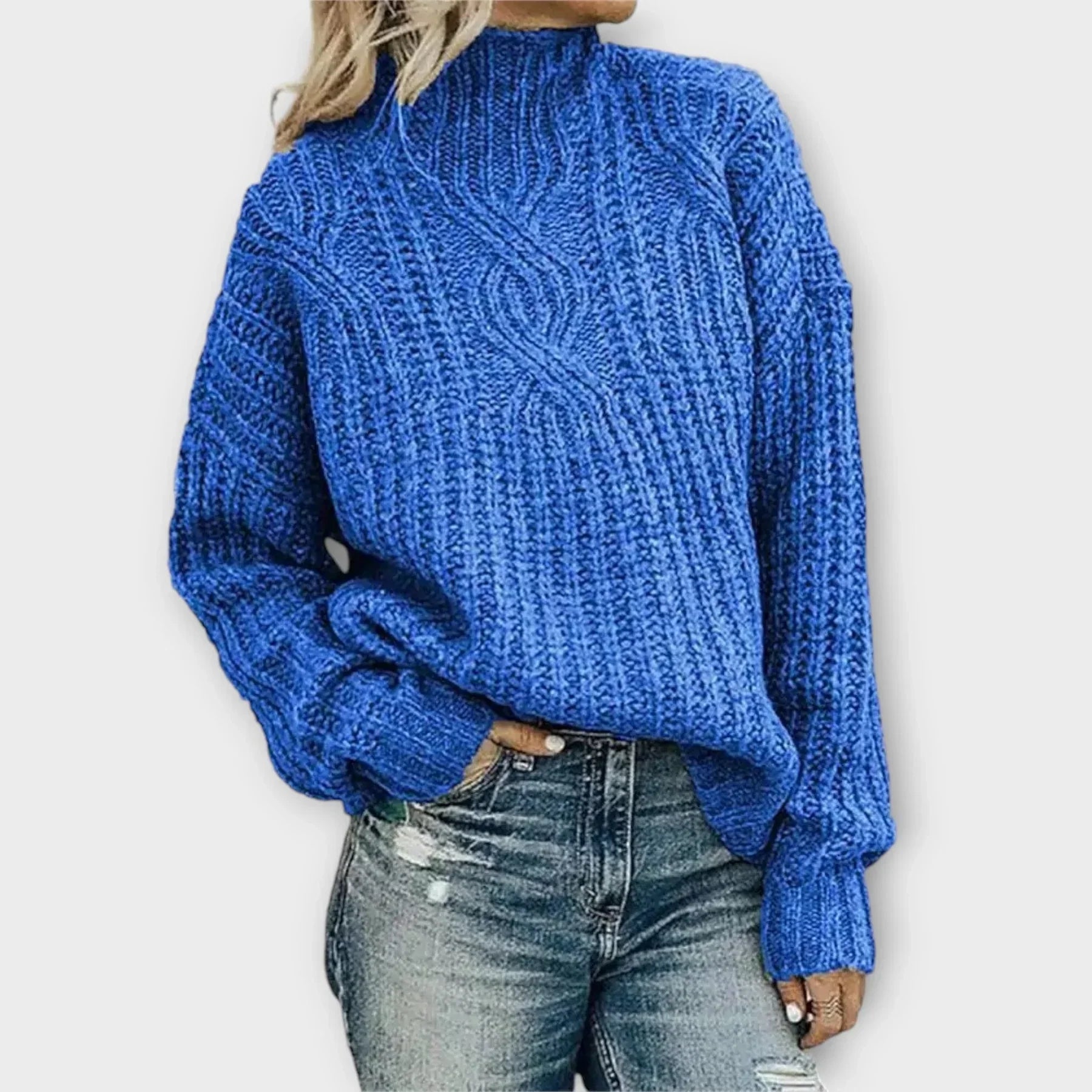 Beige cable-knit high-neck sweater with relaxed silhouette and intricate texture
