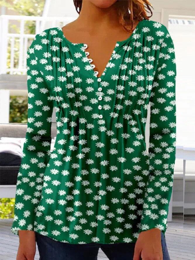 Floral women's blouse with scalloped neckline, flowing pleats, soft feminine cut for everyday elegance
