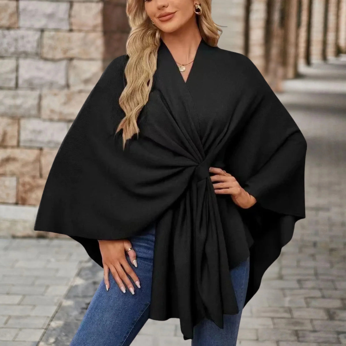 Elegant draped poncho with chic front knot, flowing silhouette, soft cozy wrap style layer