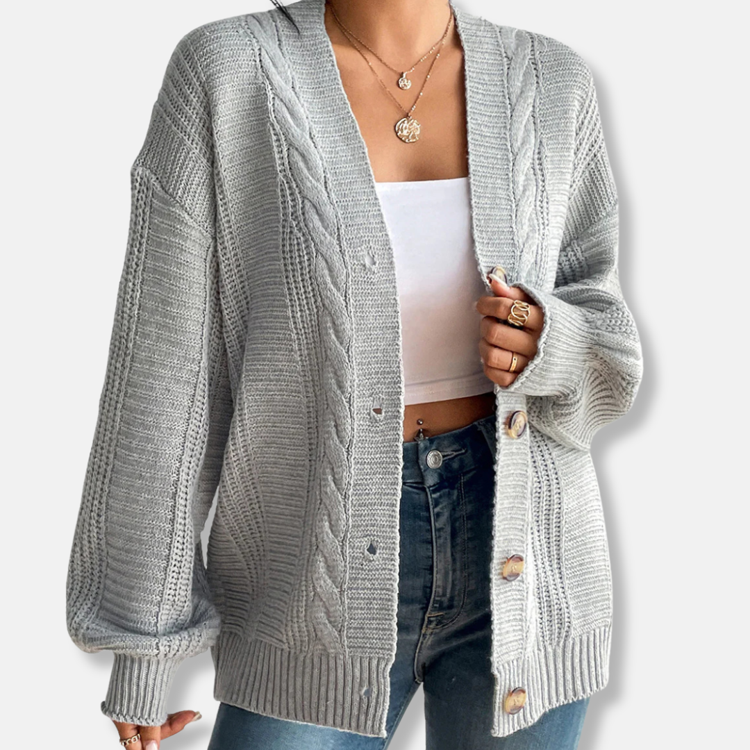 Women's oversized wool blend cable knit cardigan in neutral tones, button-front cozy fall layer