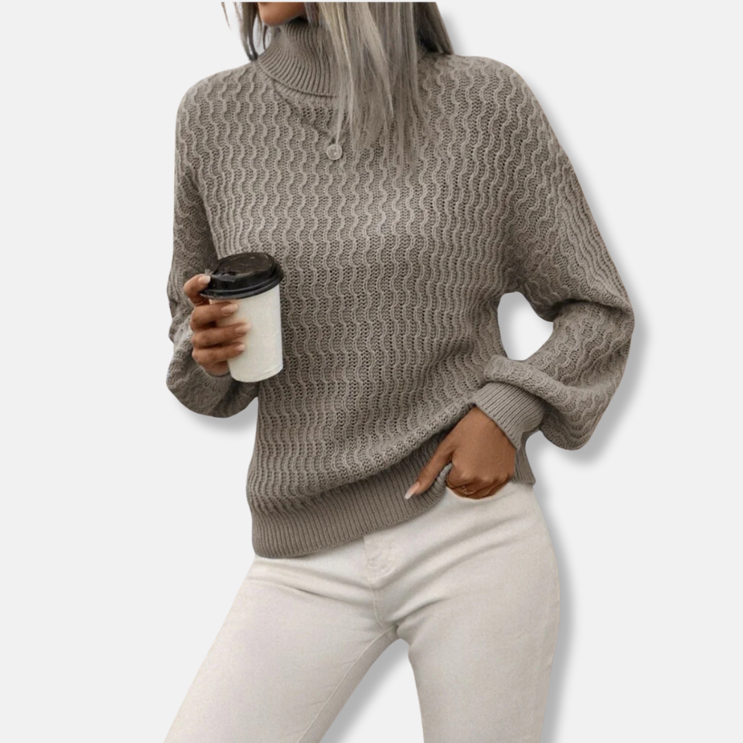 Women's ivory turtleneck knit sweater with dramatic balloon sleeves and relaxed cozy fit