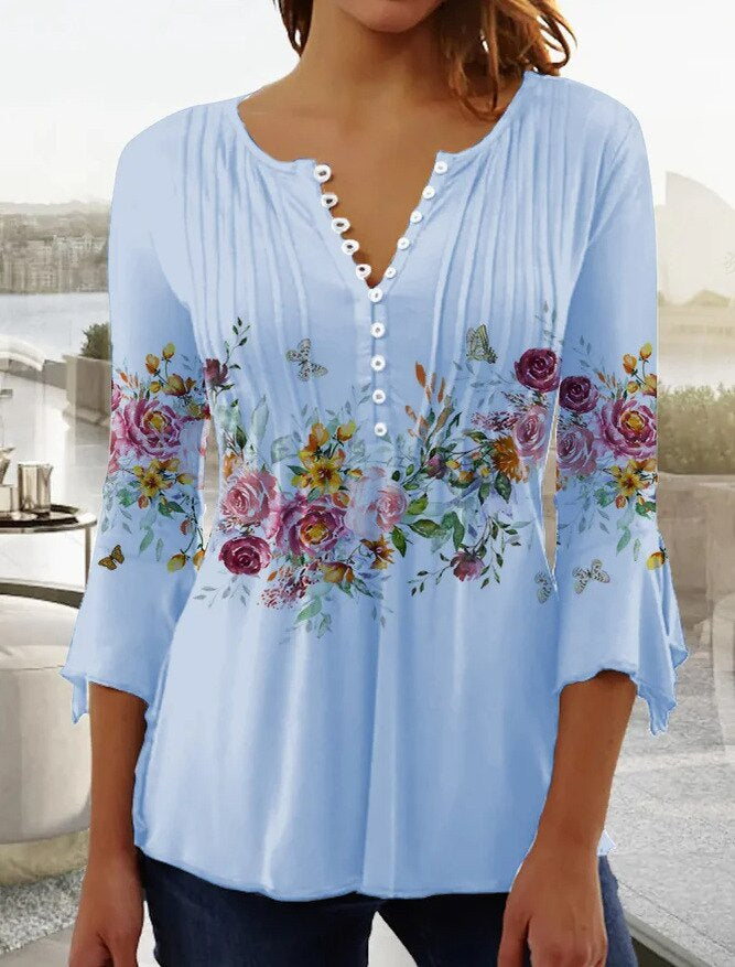 Floral women's blouse with scalloped neckline, flowing pleats, soft feminine everyday elegance style