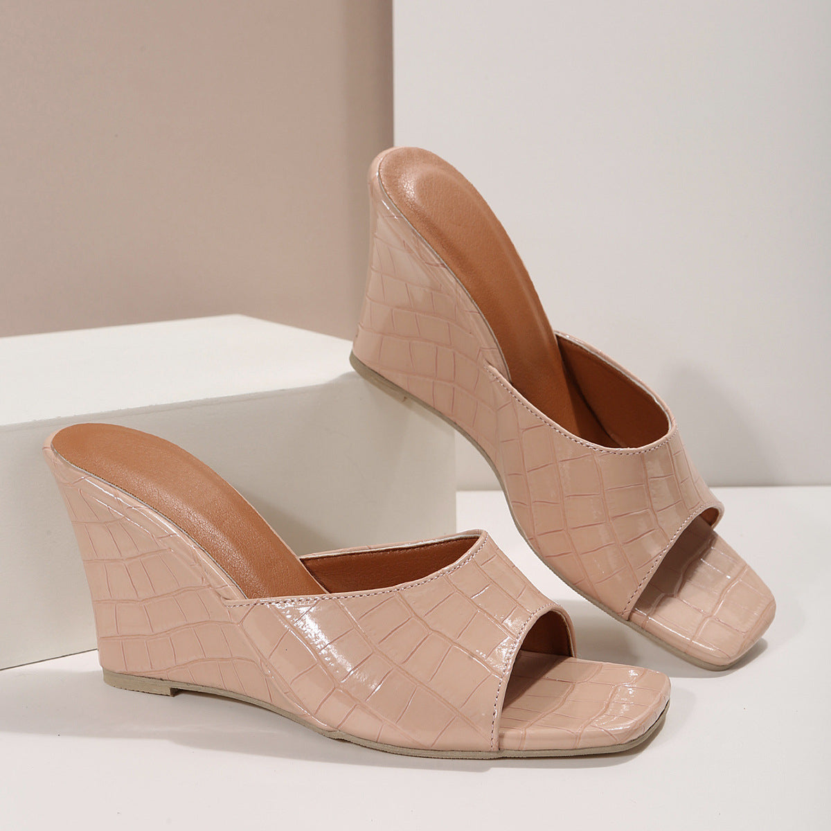 Women's faux snakeskin leather wedge shoes with cushioned sole and bold textured finish