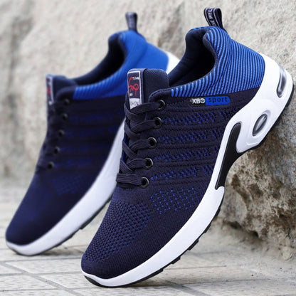 White comfort sneakers with breathable mesh upper and cushioned sole for all-day comfort