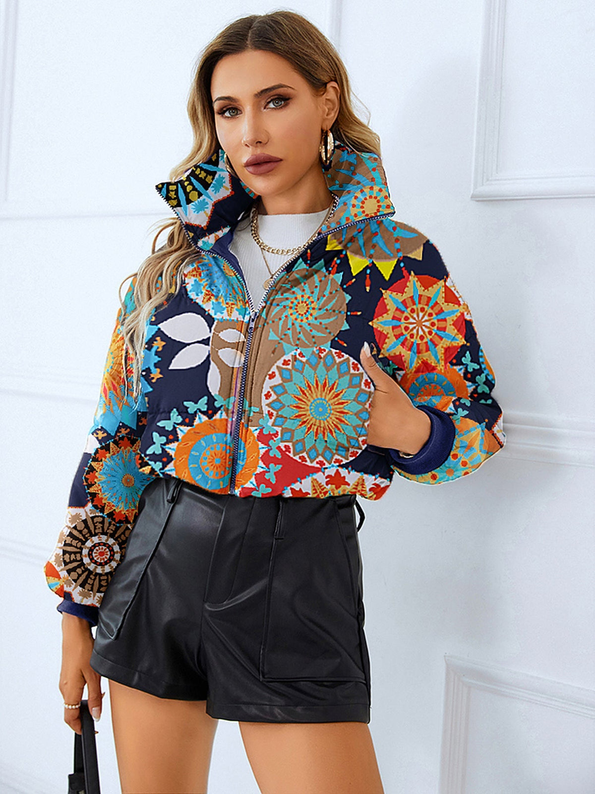 Women's short black puffer jacket slim fit with bold leopard skull print for edgy winter outerwear