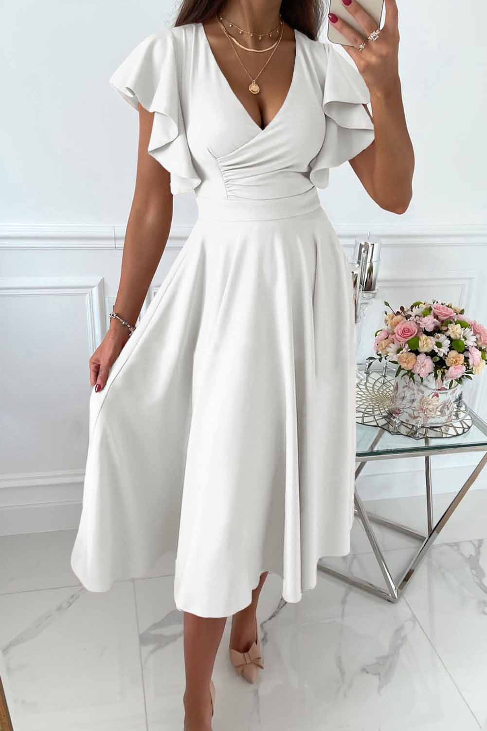 Women's wrap dress with ruffle sleeves and V-neck, elegant feminine silhouette for versatile occasions