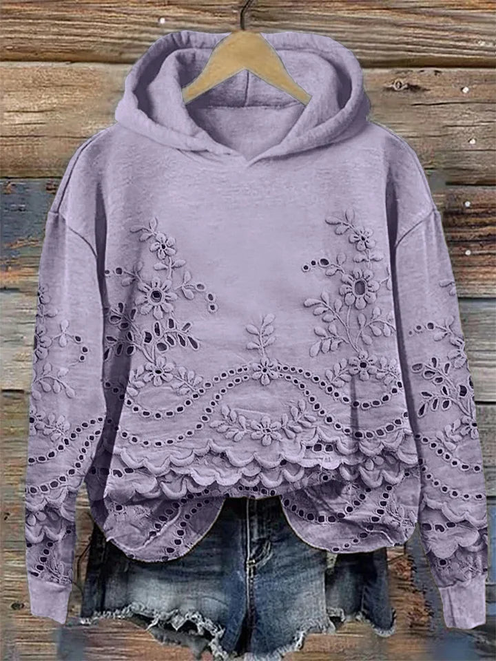 Relaxed-fit floral embroidered hoodie in soft neutral tones with delicate feminine stitching detail