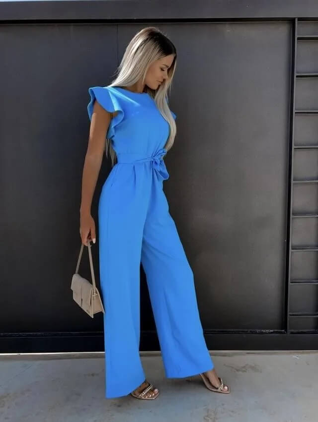 Champagne wide leg jumpsuit with ruffle cap sleeves, self-tie belt, and floor-length tailored trousers