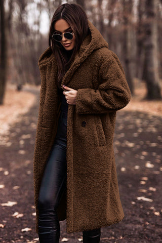 Women's beige longline faux fur hooded coat with plush oversized silhouette and cozy winter texture