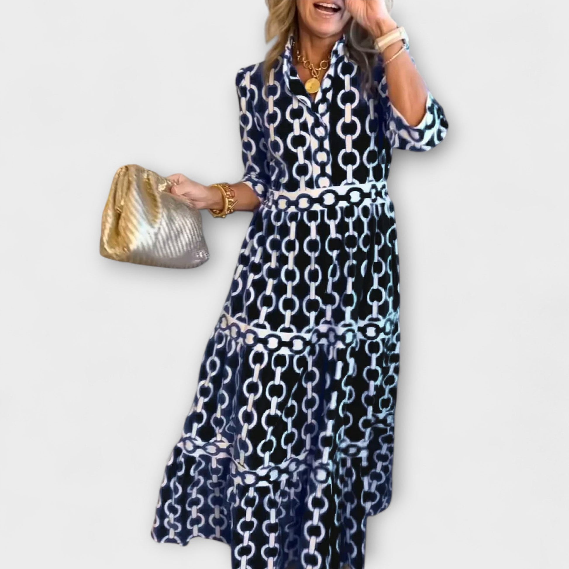 Floral chain pattern midi dress with tiered skirt, three-quarter sleeves, and smoothing waistline