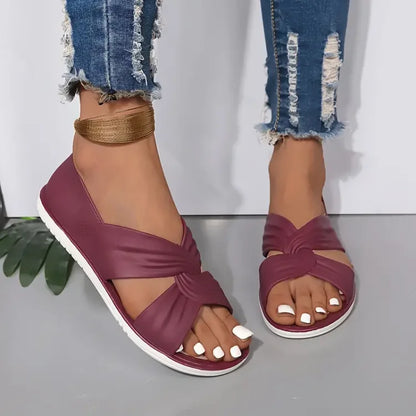 Women's beige knot-detail sandals with cushioned sole, elegant minimalist style for all-day comfort